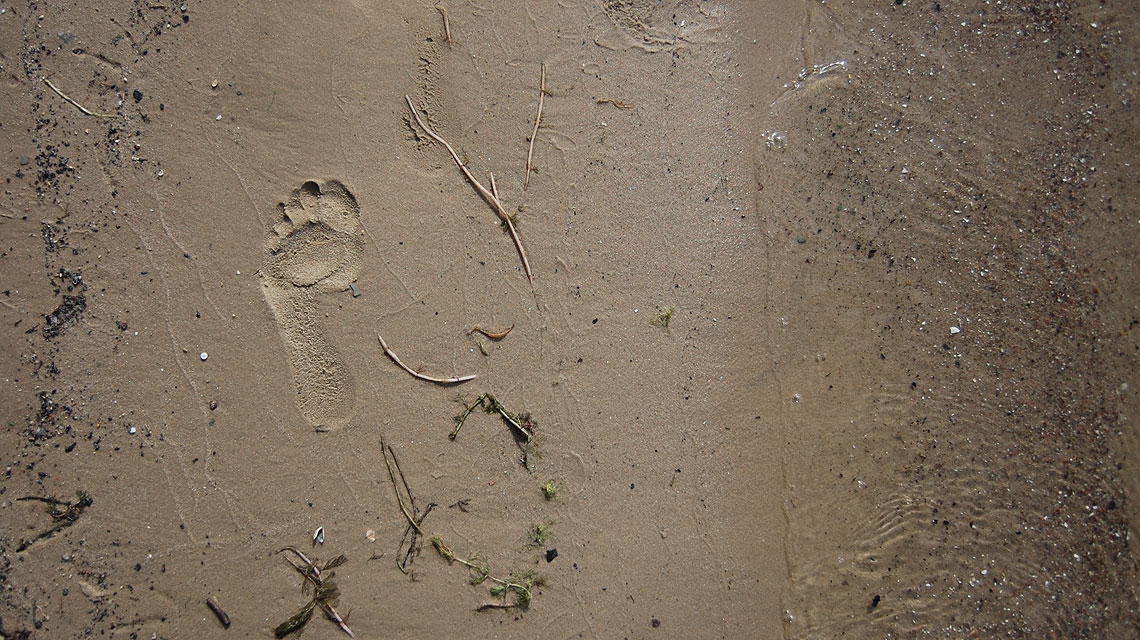 Fußabdruck-Strand-Sand